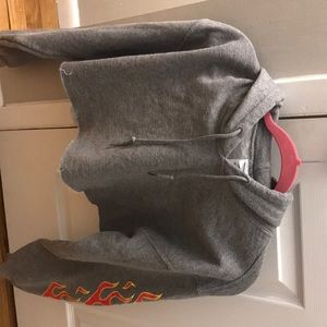 Cropped grey hoodie with flames on both sleeves